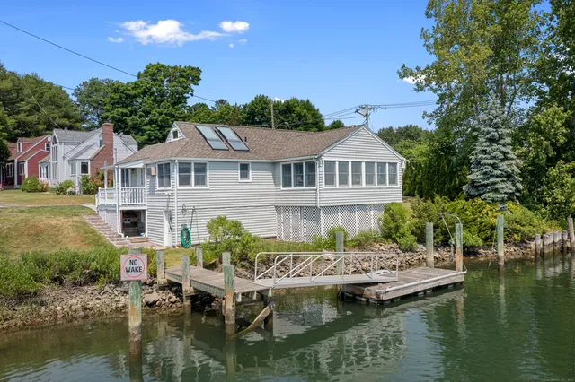 a view of a lake with a house in the background