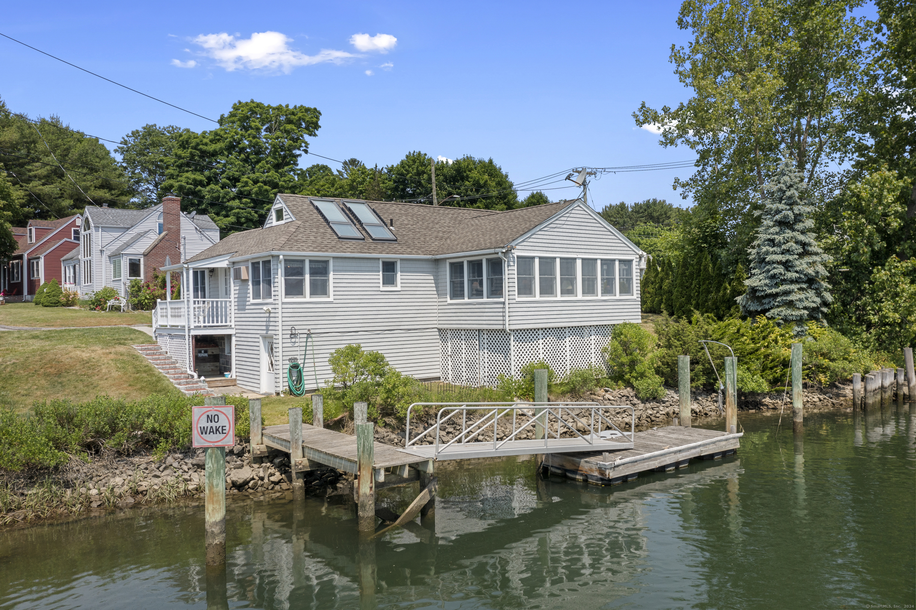 a view of a lake with a house in the background