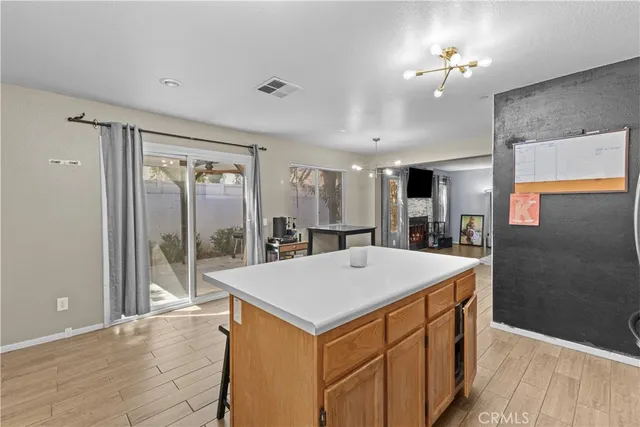 a view of a room that has a table and chairs