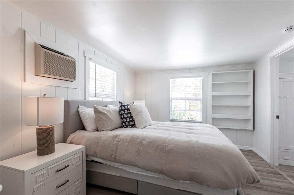 640 Broadway Street Longboat Key, FL 34228 - Photo 11 of 26 a bedroom with a bed and wooden floor