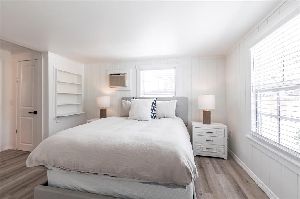 640 Broadway Street Longboat Key, FL 34228 - Photo 12 of 26 a bedroom with a bed and a window