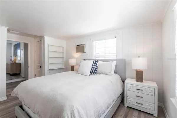 a bedroom with a bed and a closet