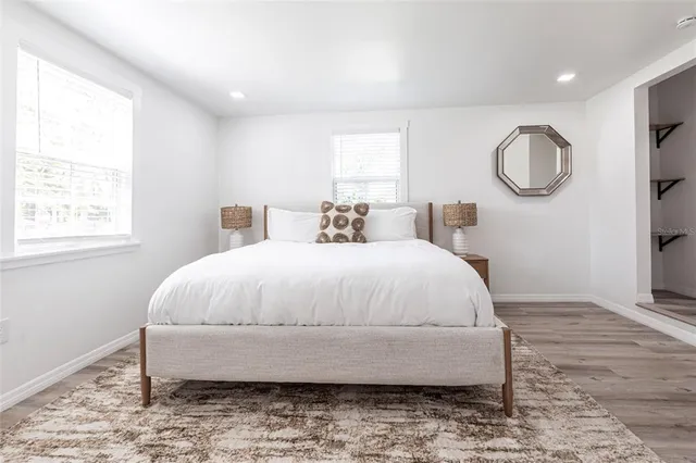 a bedroom with bed and a window