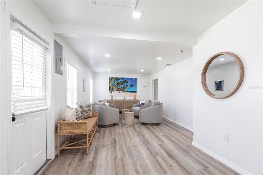 640 Broadway Street Longboat Key, FL 34228 - Photo 2 of 26 a living room with furniture and a large window