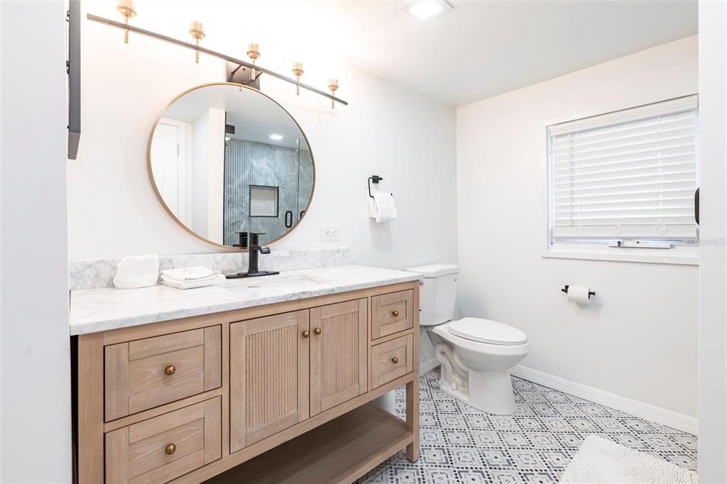 640 Broadway Street Longboat Key, FL 34228 - Photo 22 of 26 a bathroom with a toilet sink and mirror