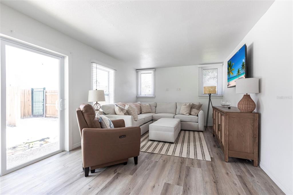 640 Broadway Street Longboat Key, FL 34228 - Photo 24 of 26 a living room with furniture and a wooden floor