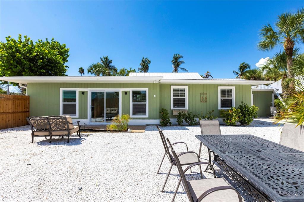 640 Broadway Street Longboat Key, FL 34228 - Photo 25 of 26 a house with outdoor seating space