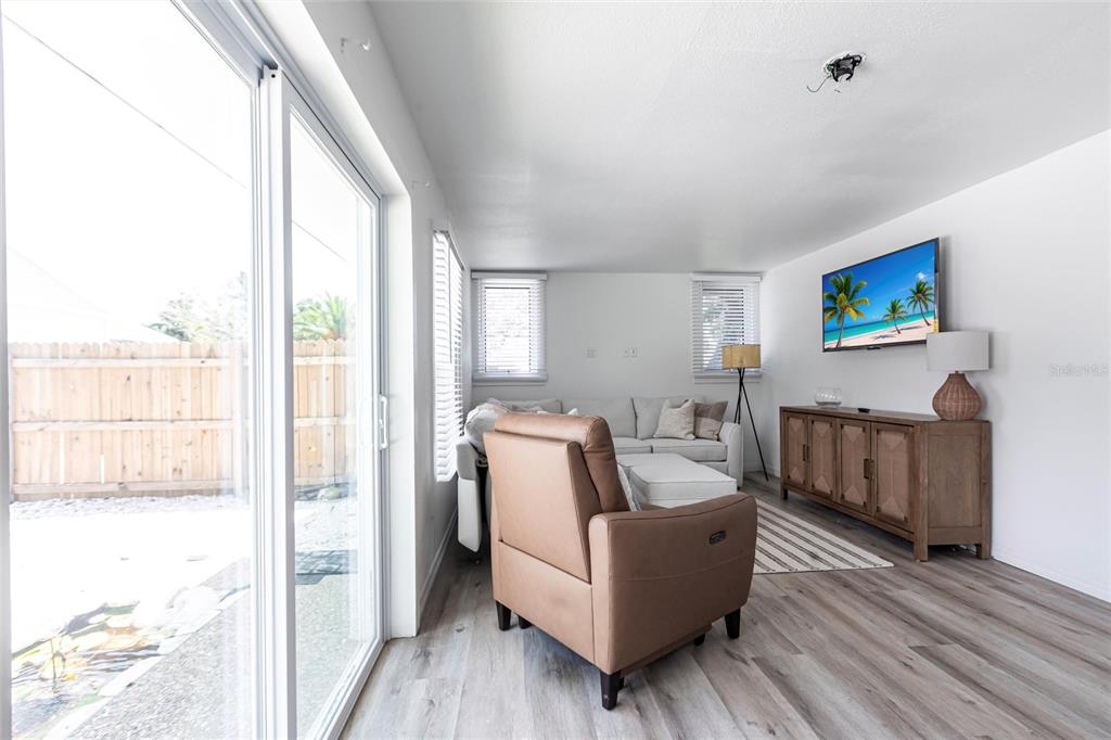 640 Broadway Street Longboat Key, FL 34228 - Photo 5 of 26 a living room with furniture and a flat screen tv