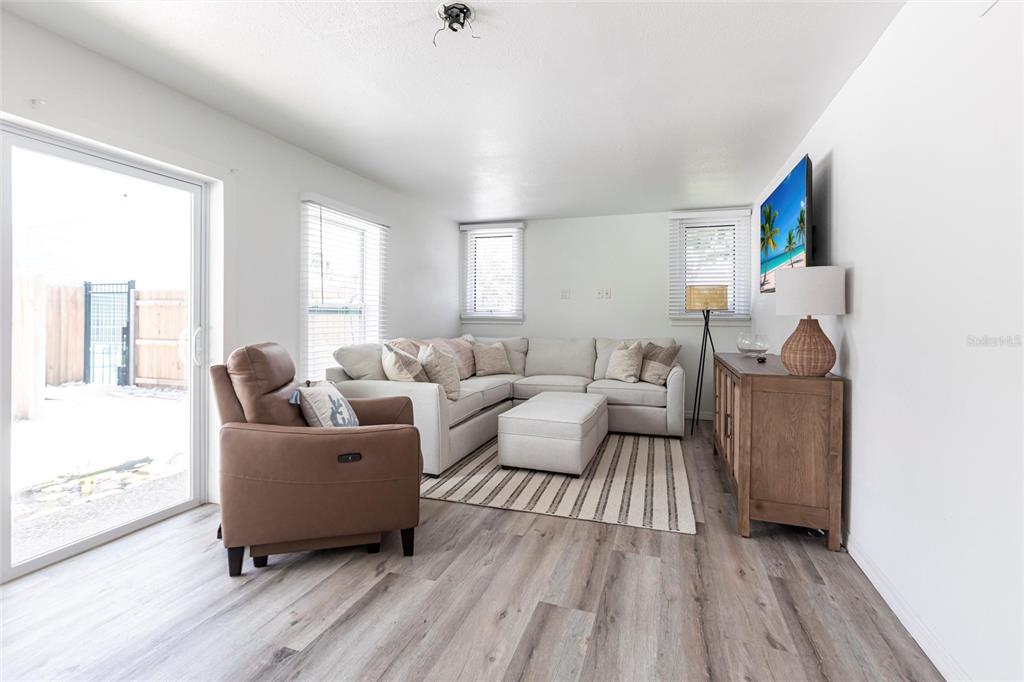 640 Broadway Street Longboat Key, FL 34228 - Photo 6 of 26 a living room with furniture and a wooden floor
