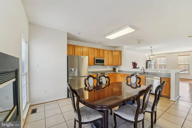 a view of a dining room with furniture and window