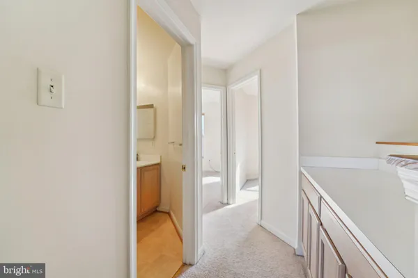 a bathroom with a tub and sink