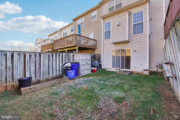 a view of a house with backyard and porch