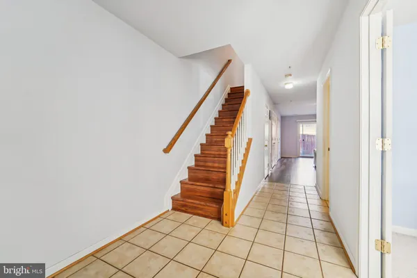 a view of a hallway with stairs