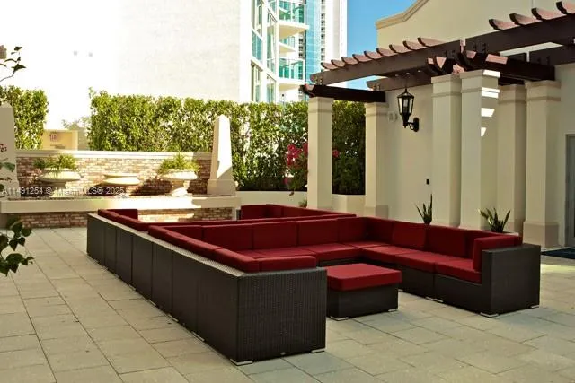a view of a living room with a couch and table chair