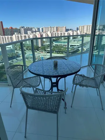 a view of a chairs and table in patio