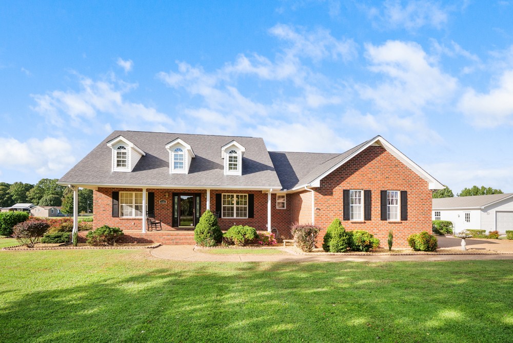 1303 Abiff Road Bon Aqua, TN 37025 - Photo 1 of 50 a front view of a house with a yard