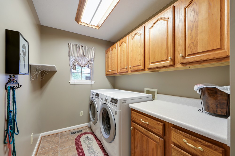 1303 Abiff Road Bon Aqua, TN 37025 - Photo 17 of 50 a utility room with dryer and washer