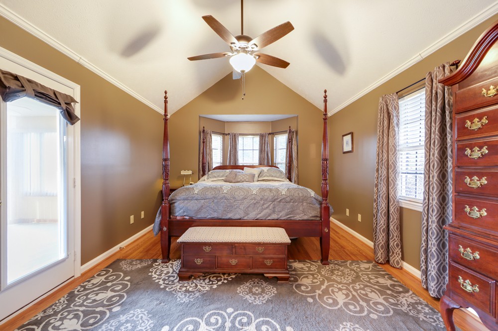 1303 Abiff Road Bon Aqua, TN 37025 - Photo 19 of 50 a bedroom with a bed and a large window with the outer view