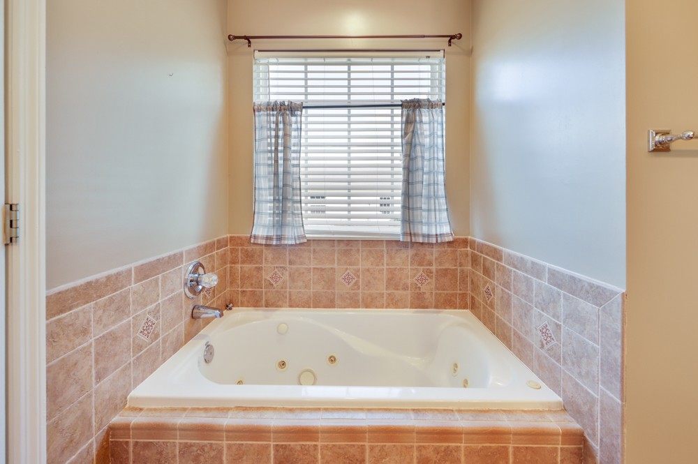 1303 Abiff Road Bon Aqua, TN 37025 - Photo 21 of 50 a bathroom with a bathtub