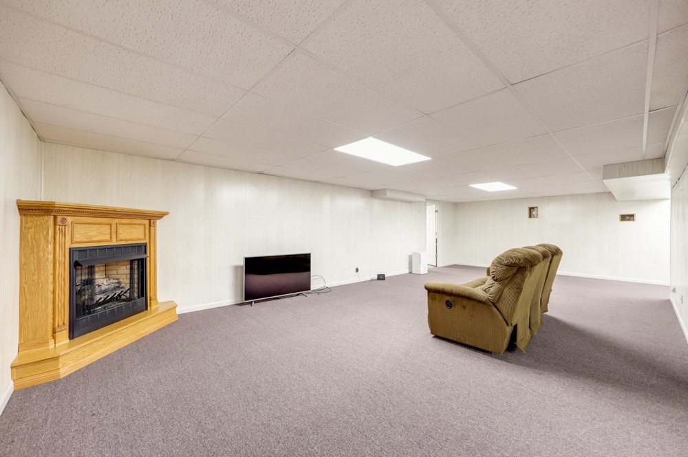 1303 Abiff Road Bon Aqua, TN 37025 - Photo 29 of 50 a living room with furniture and a fireplace