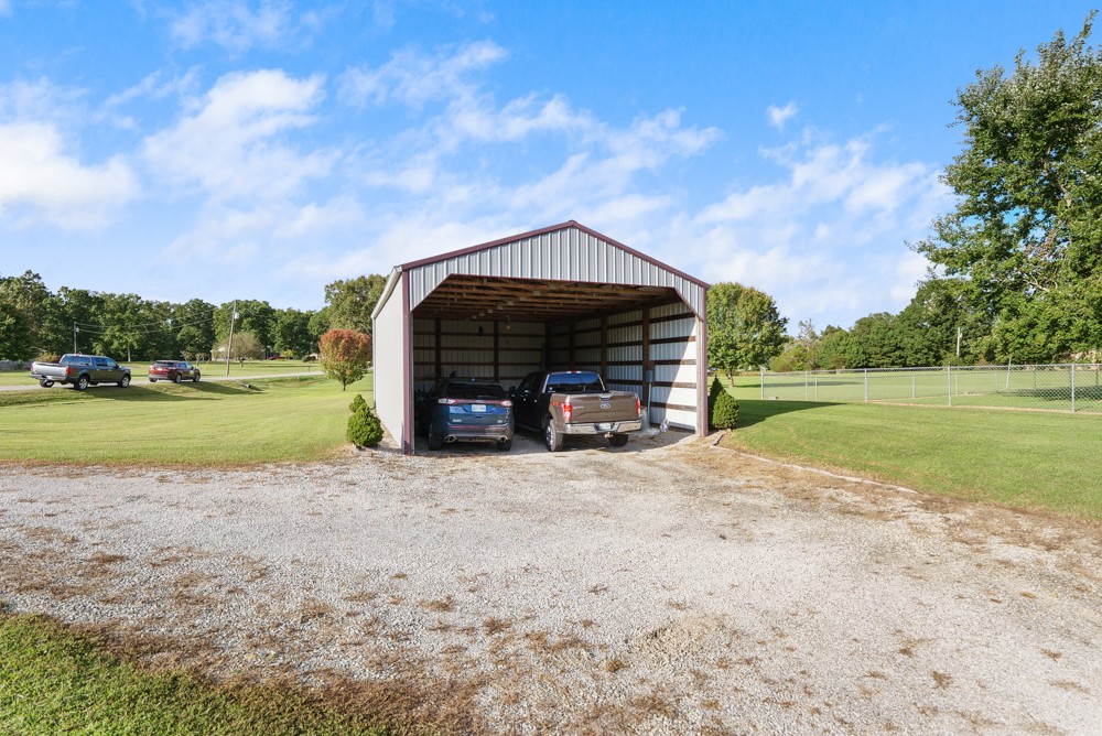 1303 Abiff Road Bon Aqua, TN 37025 - Photo 42 of 50 a view of a house with a yard