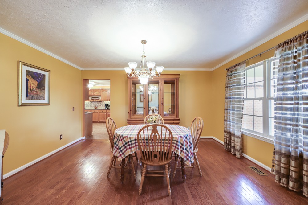 1303 Abiff Road Bon Aqua, TN 37025 - Photo 9 of 50 a view of a dining room with furniture window and wooden floor