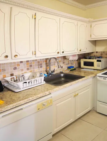 a kitchen with a stove and a refrigerator