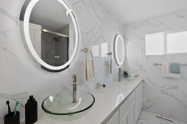 a bathroom with a sink and a mirror