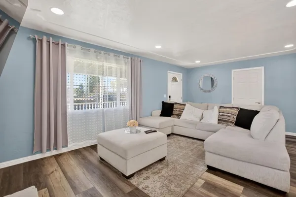 a living room with furniture and a large window