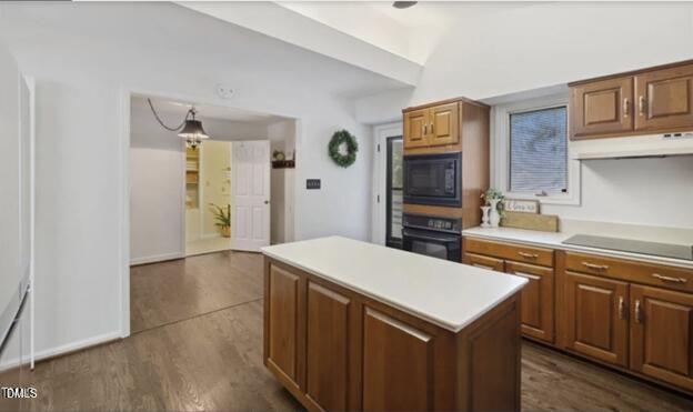 3317 Harden Road Raleigh, NC 27607 - Photo 8 of 52 a kitchen that has a kitchen island wooden cabinets and refrigerator