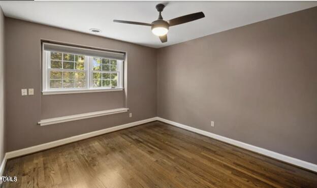 3317 Harden Road Raleigh, NC 27607 - Photo 19 of 52 en empty room with wooden floor and windows
