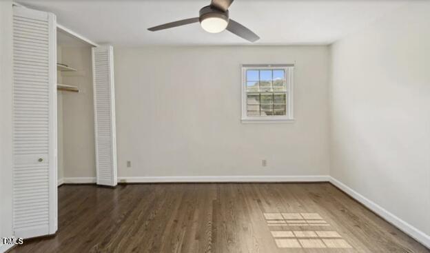 3317 Harden Road Raleigh, NC 27607 - Photo 23 of 52 an empty room with wooden floor cabinet and windows