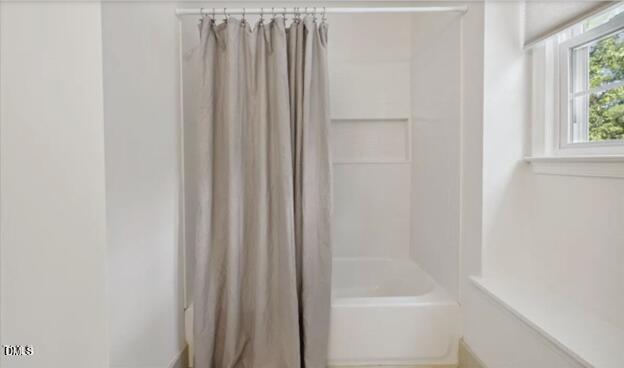 3317 Harden Road Raleigh, NC 27607 - Photo 26 of 52 a bathroom with bathtub and window
