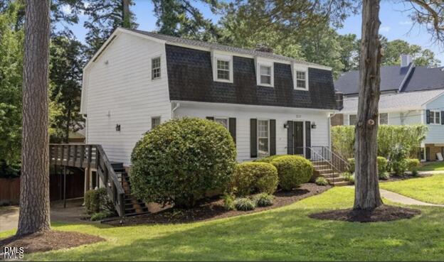3317 Harden Road Raleigh, NC 27607 - Photo 2 of 52 a view of a house with a yard and plants