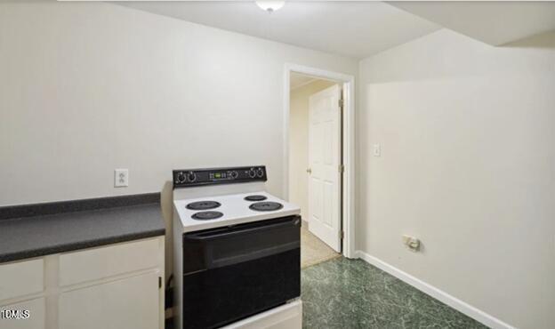3317 Harden Road Raleigh, NC 27607 - Photo 35 of 52 a kitchen with a stove and a cabinet