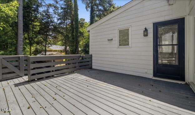 3317 Harden Road Raleigh, NC 27607 - Photo 39 of 52 a view of a house with backyard and wooden fence