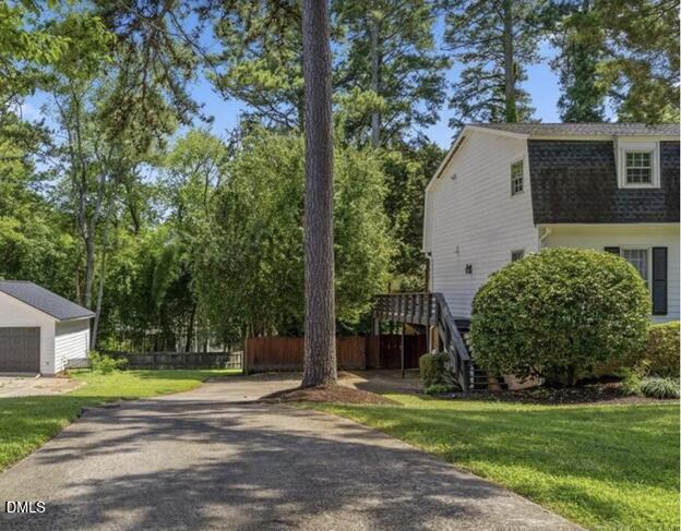 3317 Harden Road Raleigh, NC 27607 - Photo 3 of 52 a view of a house with a yard and large trees
