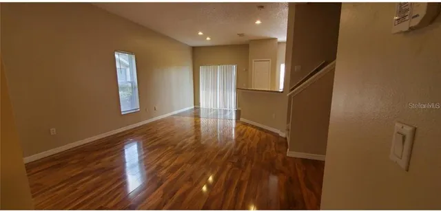 a view of entryway with wooden floor