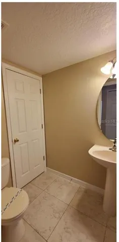 a view of a room with wooden floor and glass door