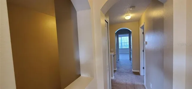 a view of a hallway with front door