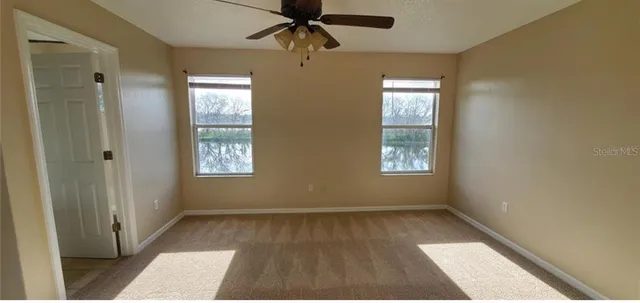 a bed room with a bed and a mirror