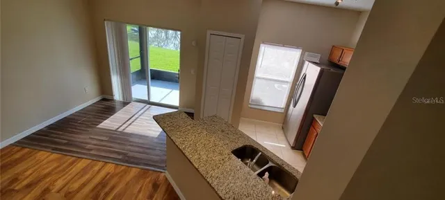 a view of balcony with wooden floor