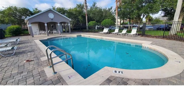 a childrens park with lots of swings and slides