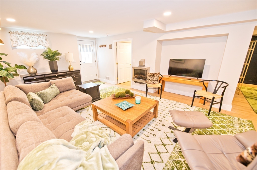 16 Warren Avenue Newton, MA 02465 - Photo 24 of 42 a living room with furniture and a flat screen tv