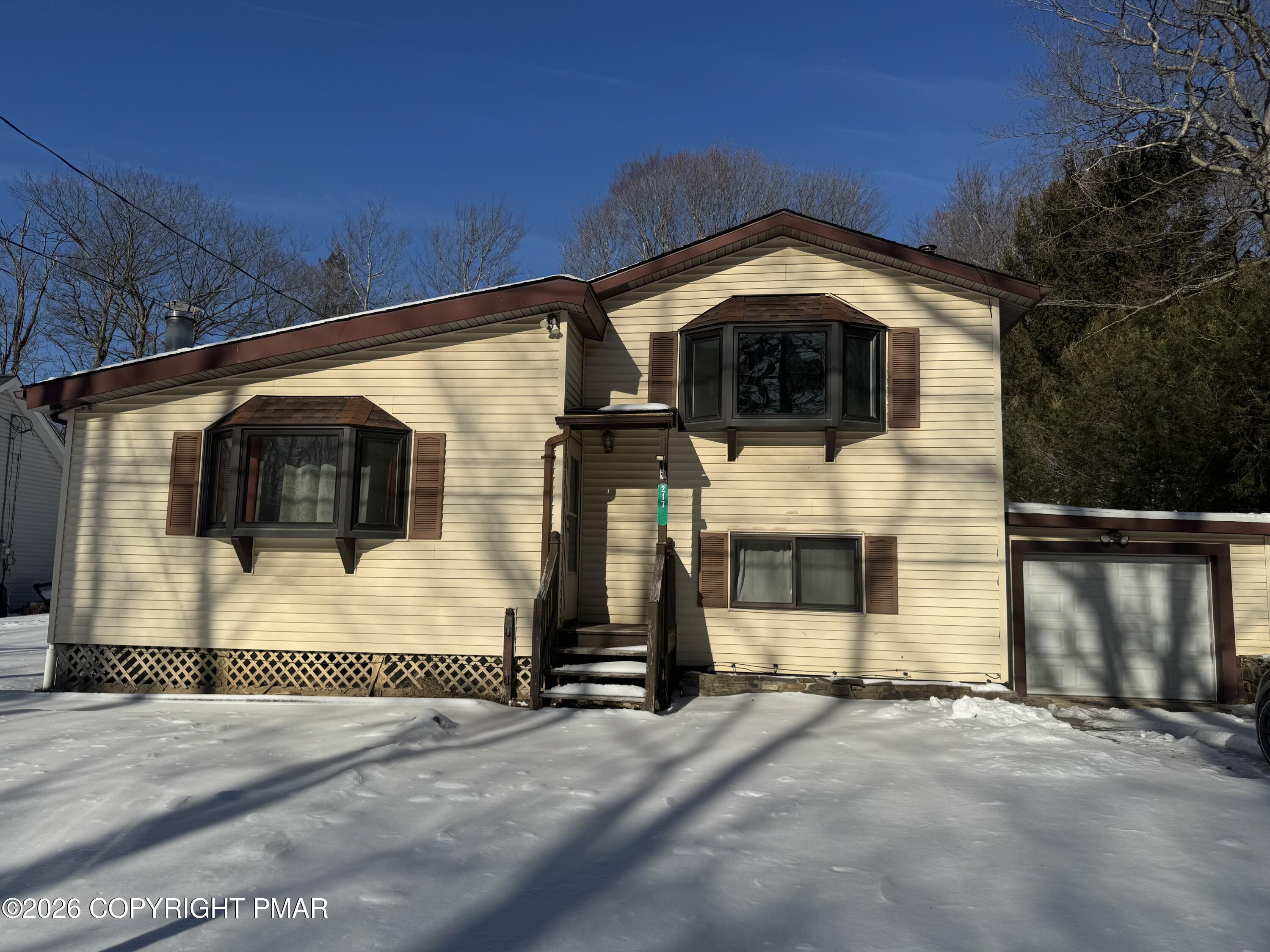 217 Coach Road Tobyhanna, PA 18466 - Photo 2 of 28 a front view of a house with a yard