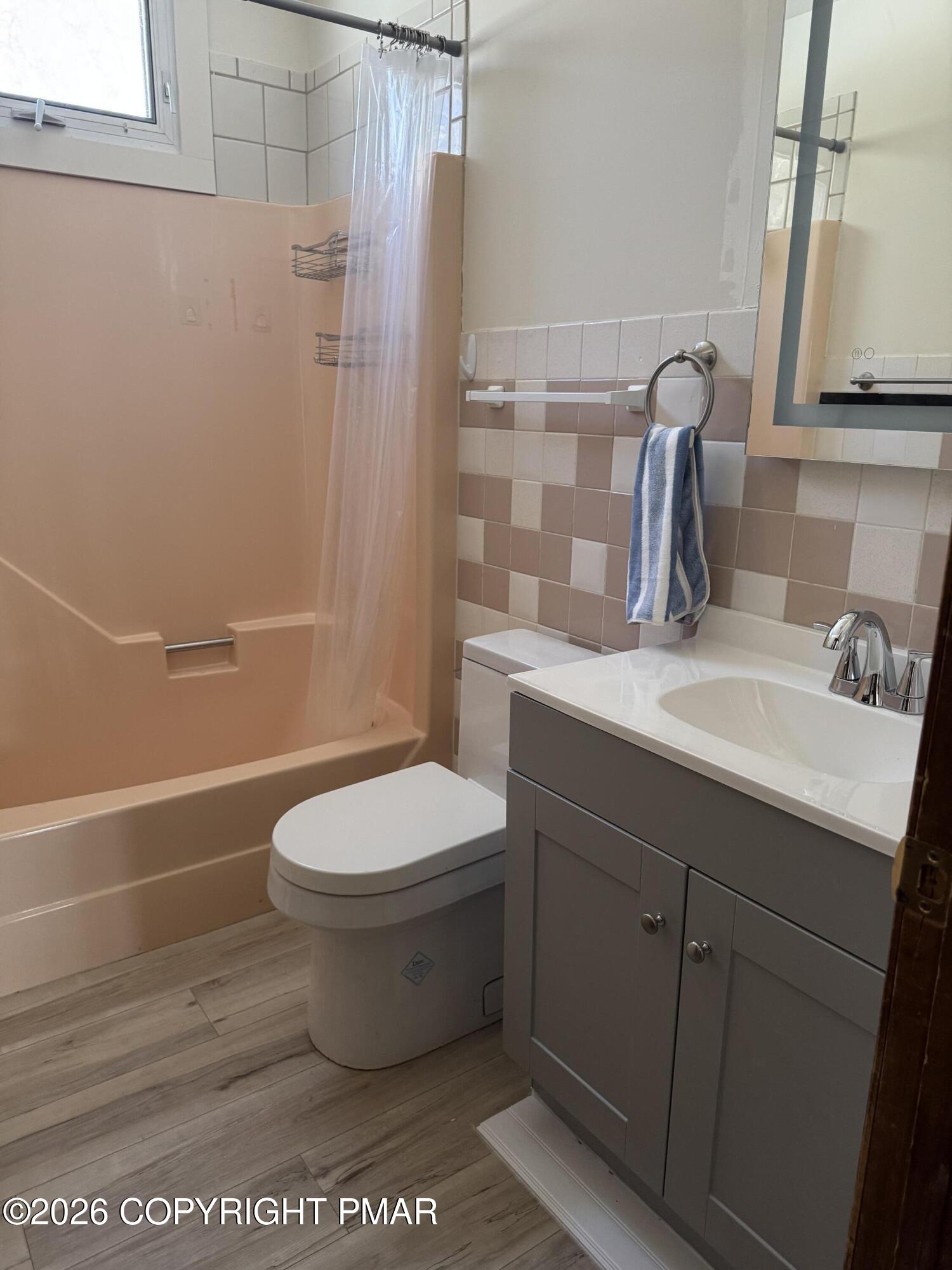 217 Coach Road Tobyhanna, PA 18466 - Photo 21 of 28 a bathroom with a sink a toilet and shower