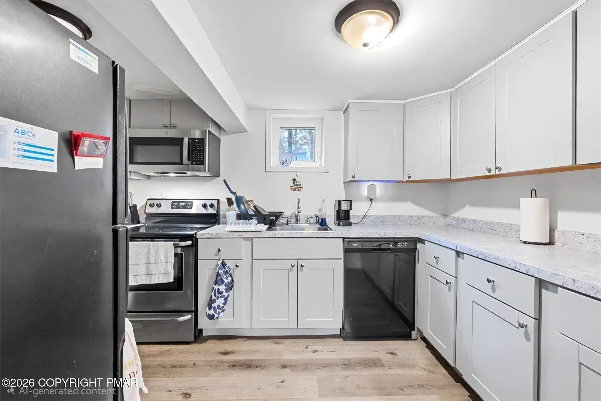 217 Coach Road Tobyhanna, PA 18466 - Photo 3 of 28 a kitchen with stainless steel appliances granite countertop a sink stove and cabinets