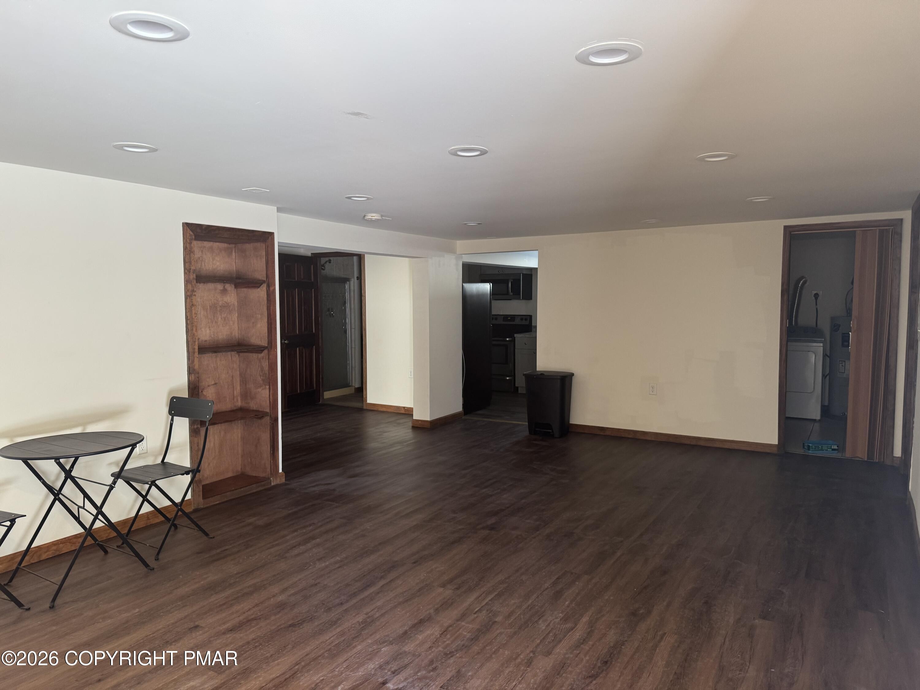 217 Coach Road Tobyhanna, PA 18466 - Photo 9 of 28 an empty room with wooden floor and furniture