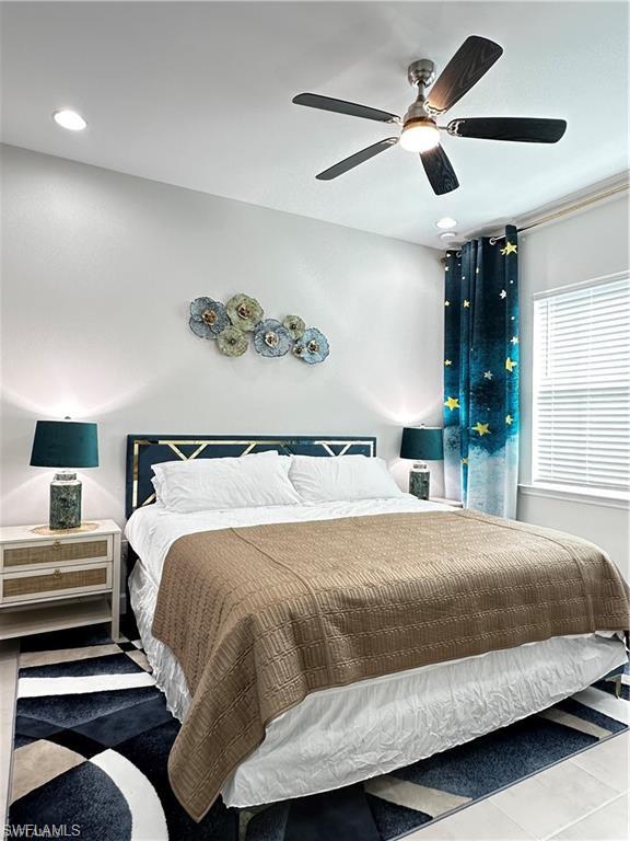 7135 Cayo Coco Lane Naples, FL 34113 - Photo 12 of 41 Bedroom featuring a ceiling fan and recessed lighting