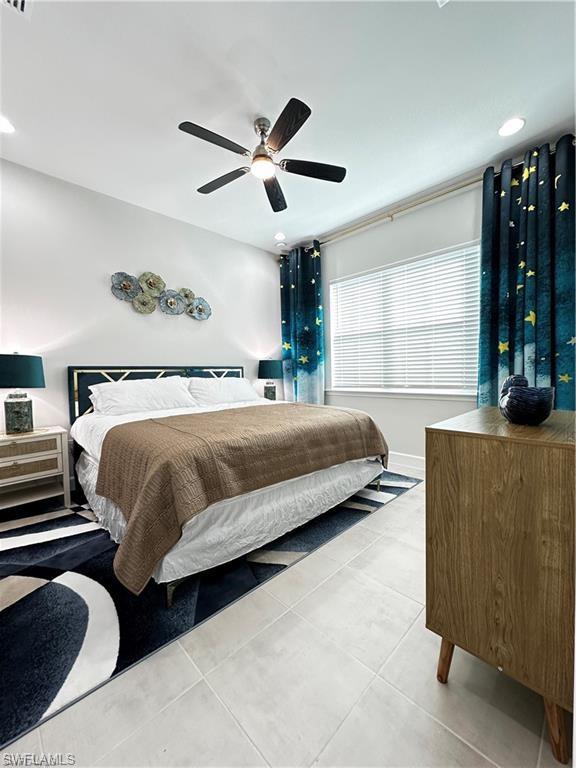 7135 Cayo Coco Lane Naples, FL 34113 - Photo 13 of 41 Bedroom featuring ceiling fan, light tile patterned floors, and recessed lighting